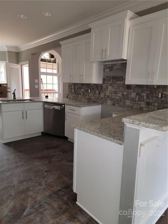 1152 Blacksnake Road Stanley, NC 28164 - Photo 3 of 15 a kitchen with sink a microwave and cabinets