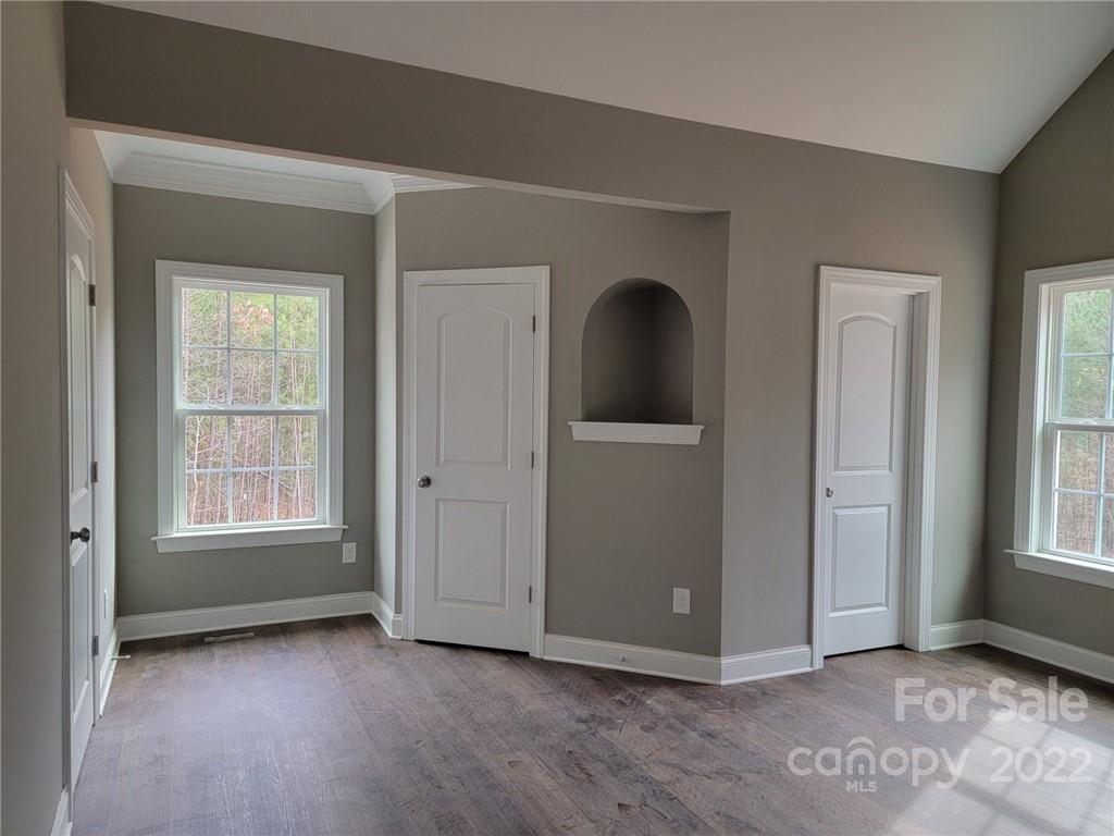 1152 Blacksnake Road Stanley, NC 28164 - Photo 8 of 15 an empty room with windows and closet