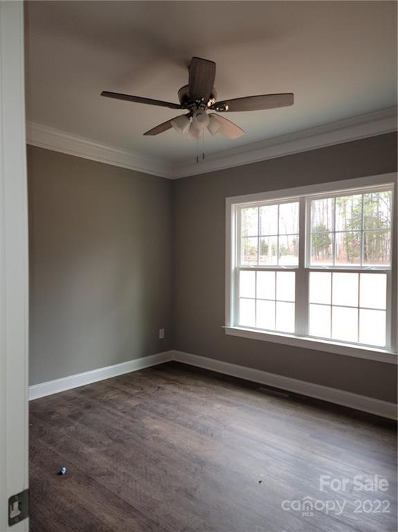 1152 Blacksnake Road Stanley, NC 28164 - Photo 10 of 15 an empty room with wooden floor and windows