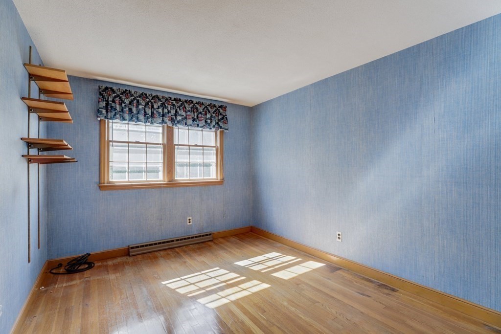 48 Maynard Street Boston, MA 02131 - Photo 11 of 23 a view of a room with wooden floor and cabinet