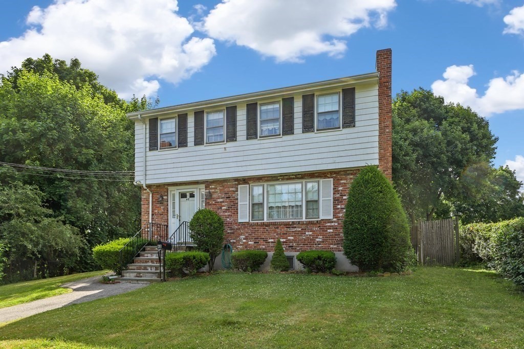 48 Maynard Street Boston, MA 02131 - Photo 17 of 23 a view of a house with a yard and plants
