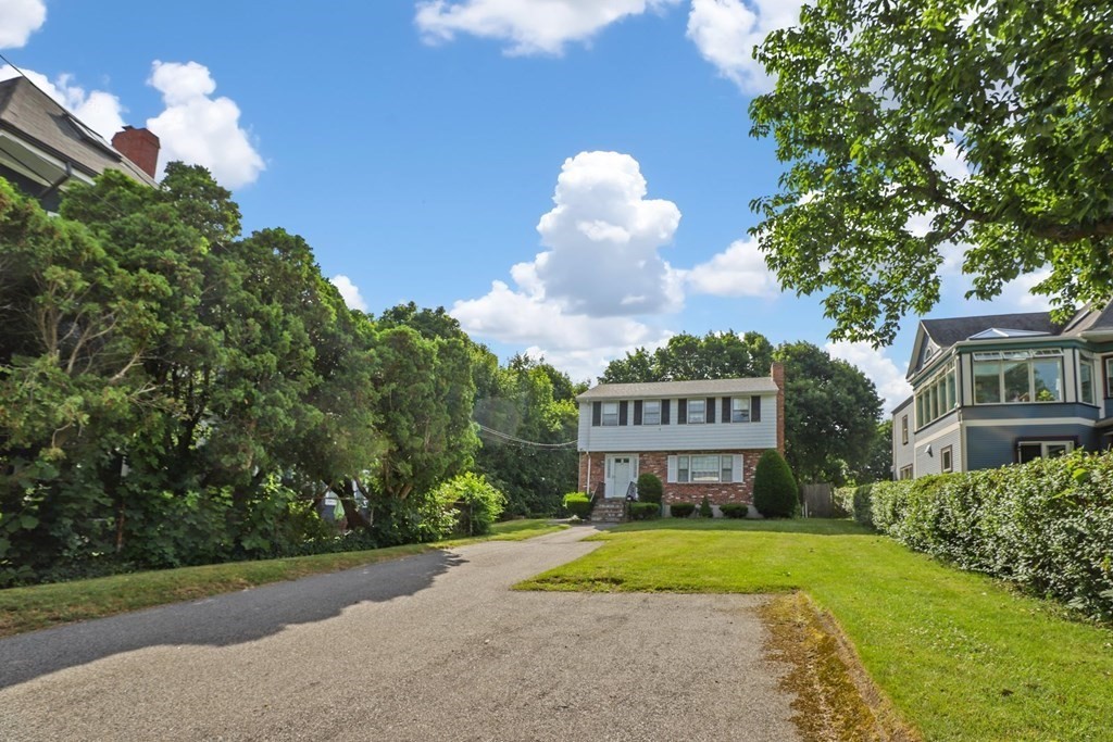 48 Maynard Street Boston, MA 02131 - Photo 21 of 23 a view of a big house with a big yard and large trees