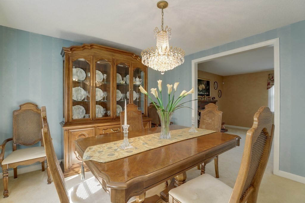 48 Maynard Street Boston, MA 02131 - Photo 3 of 23 a view of a dining room with furniture and chandelier