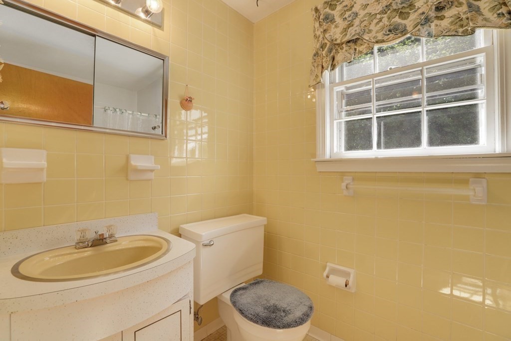 48 Maynard Street Boston, MA 02131 - Photo 5 of 23 a white toilet sitting next to a bathroom sink