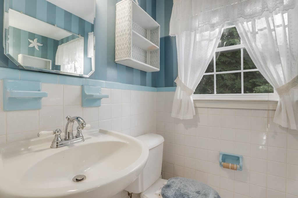 48 Maynard Street Boston, MA 02131 - Photo 9 of 23 a bathroom with a sink and a mirror