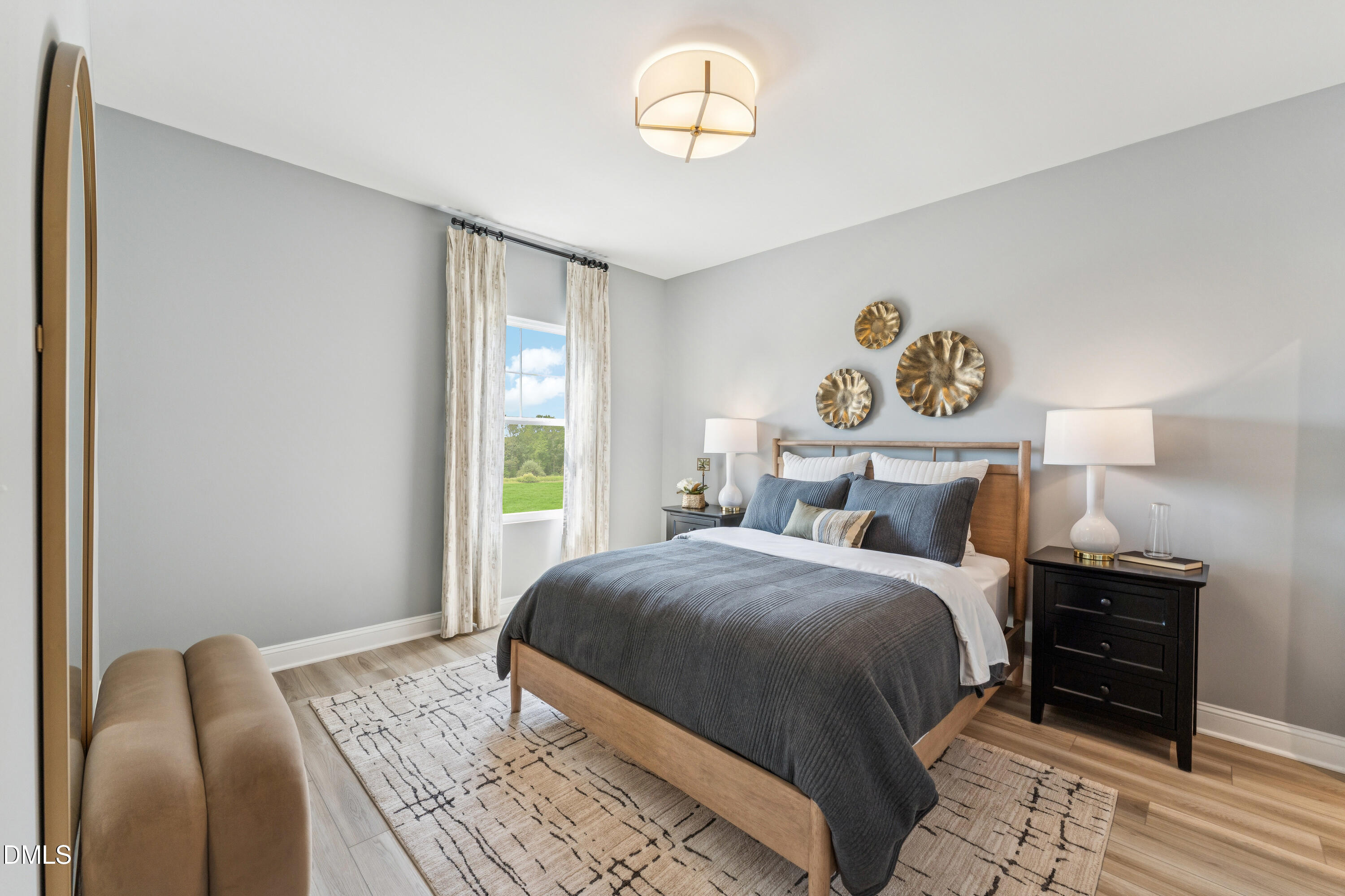 2144 Barnside Lane Apex, NC 27502 - Photo 22 of 25 a bedroom with a bed and wooden floor