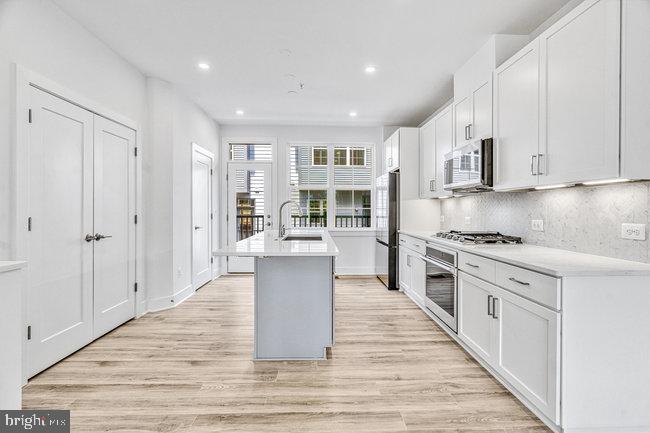 11236 Bunsen Street Reston, VA 20190 - Photo 13 of 61 Modern kitchen with sleek design.