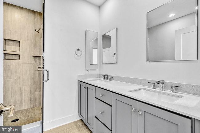 11236 Bunsen Street Reston, VA 20190 - Photo 29 of 61 Sleek modern bathroom oasis.
