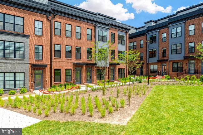 11236 Bunsen Street Reston, VA 20190 - Photo 3 of 61 Modern townhomes with lush landscaping.