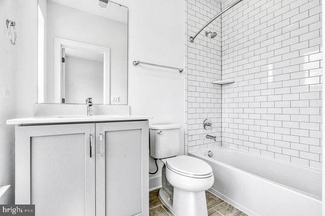 11236 Bunsen Street Reston, VA 20190 - Photo 35 of 61 Sleek, modern bathroom retreat.