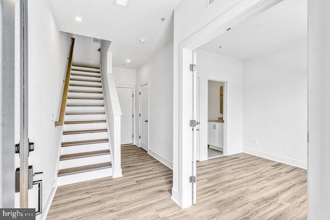 11236 Bunsen Street Reston, VA 20190 - Photo 4 of 61 Bright and airy entryway with stairs.