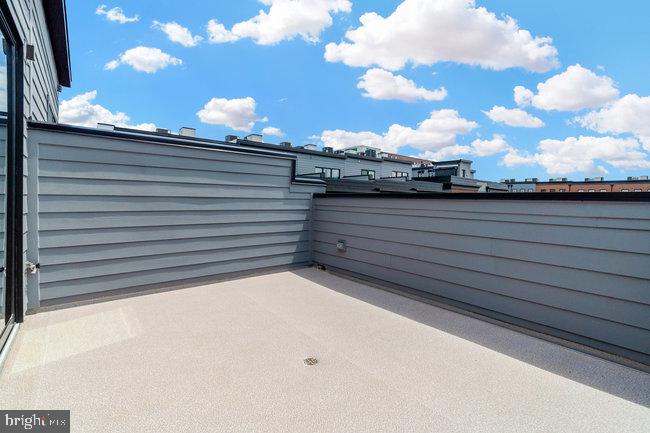 11236 Bunsen Street Reston, VA 20190 - Photo 49 of 61 Sunny rooftop retreat with blue skies.