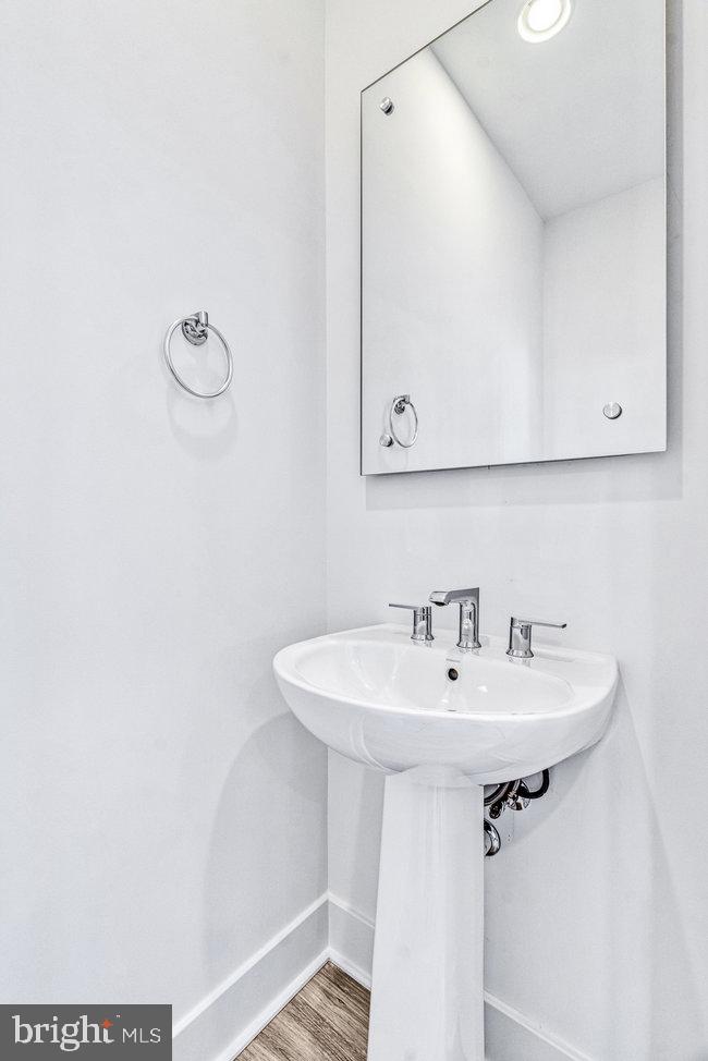 11236 Bunsen Street Reston, VA 20190 - Photo 9 of 61 Sleek and modern powder room design.