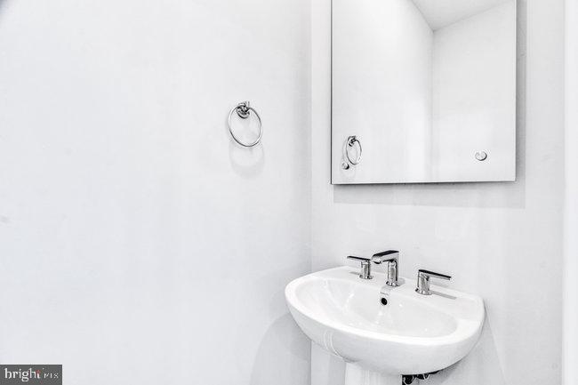 11236 Bunsen Street Reston, VA 20190 - Photo 10 of 61 Sleek and modern bathroom oasis.