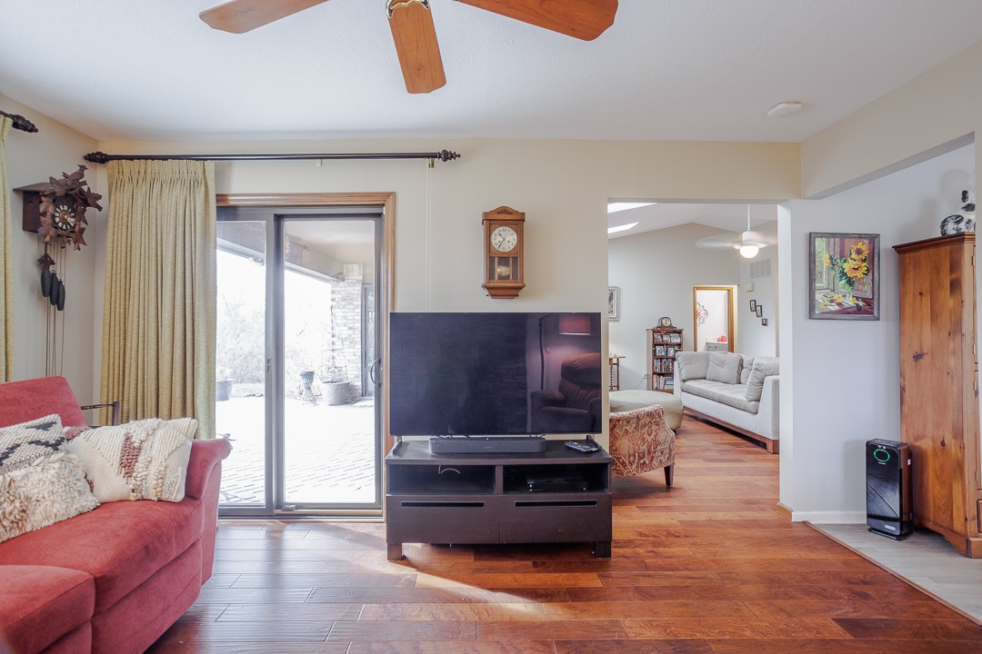 540 Basil Street Springboro, OH 45066 - Photo 12 of 32 Bright and airy living room with warm wood floors and abundant natural light.