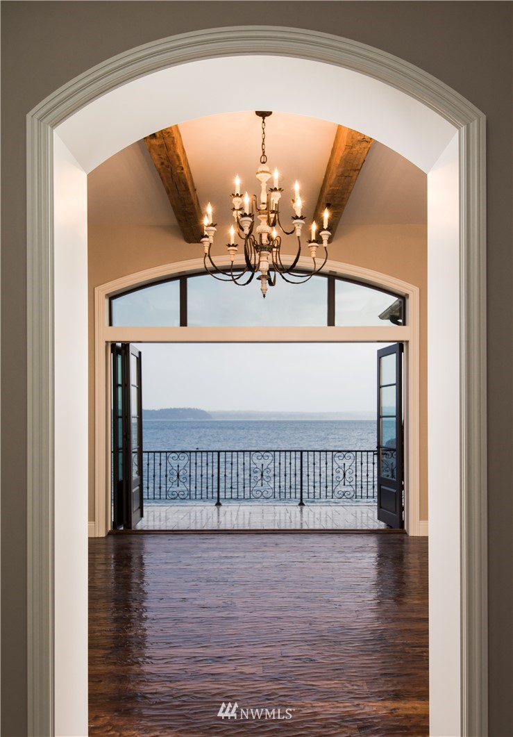8635 Fauntleroy Way Southwest Seattle, WA 98136 - Photo 2 of 36 a view of a livingroom with wooden floor and a chandelier