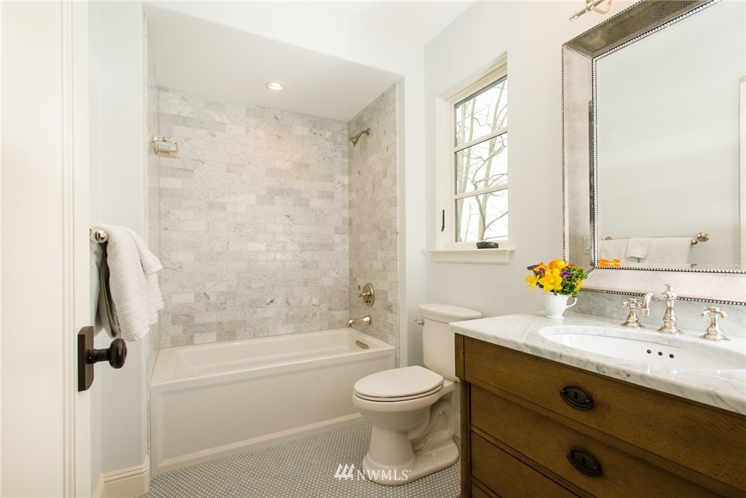 8635 Fauntleroy Way Southwest Seattle, WA 98136 - Photo 19 of 36 a bathroom with a double vanity sink toilet and shower