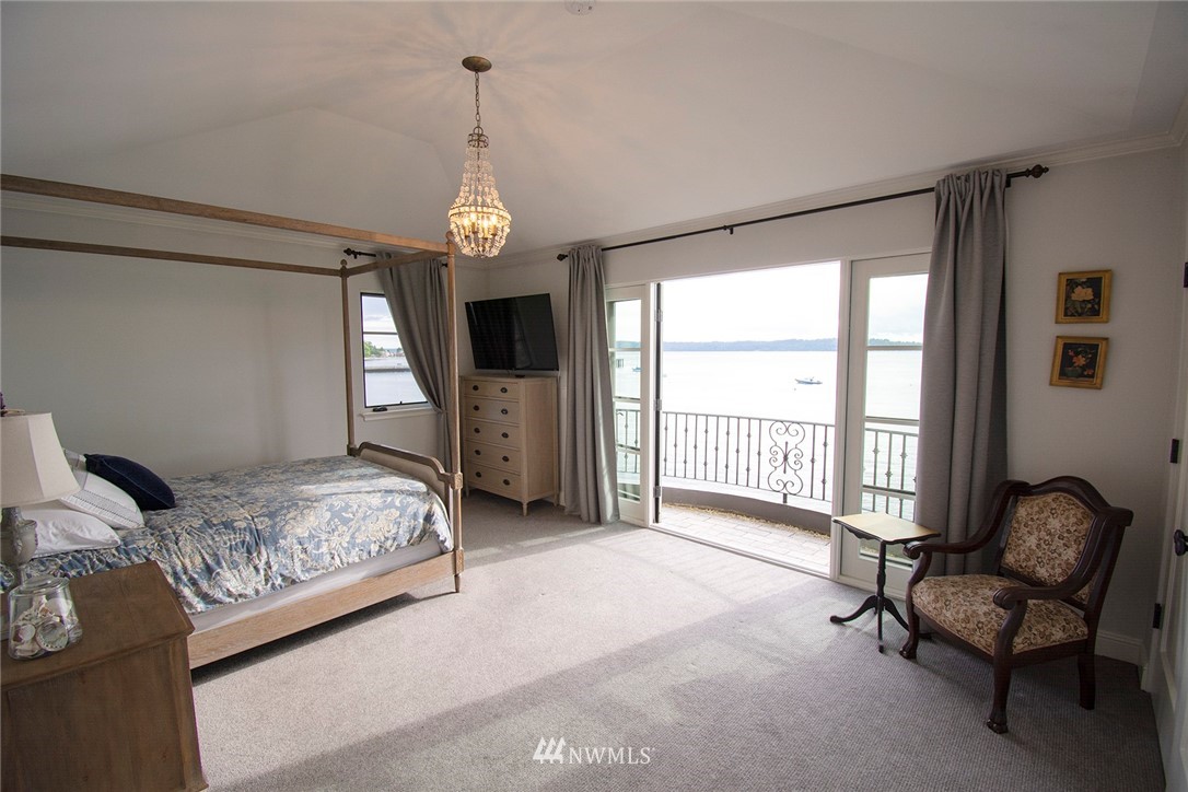8635 Fauntleroy Way Southwest Seattle, WA 98136 - Photo 20 of 36 a spacious bedroom with a bed couch and a window