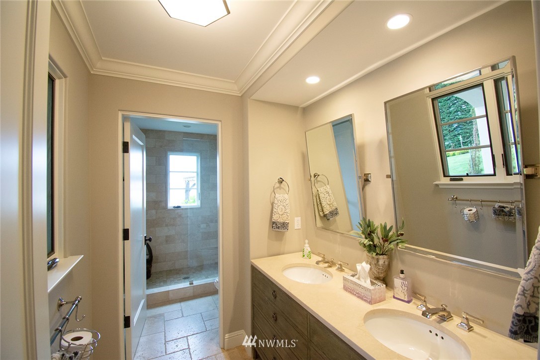 8635 Fauntleroy Way Southwest Seattle, WA 98136 - Photo 25 of 36 a bathroom with a double vanity sink mirror and shower