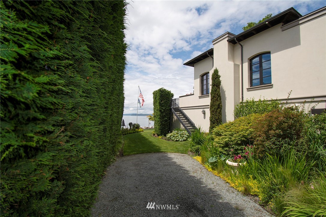 8635 Fauntleroy Way Southwest Seattle, WA 98136 - Photo 27 of 36 a front view of a house with garden