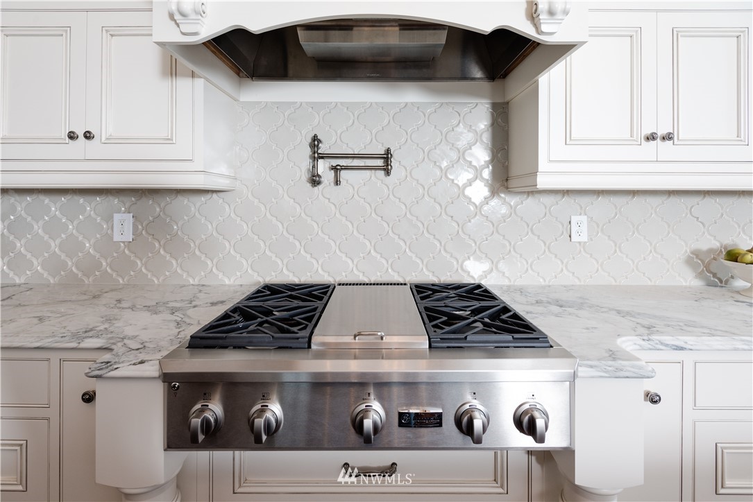 8635 Fauntleroy Way Southwest Seattle, WA 98136 - Photo 7 of 36 a stove top oven sitting inside of a kitchen