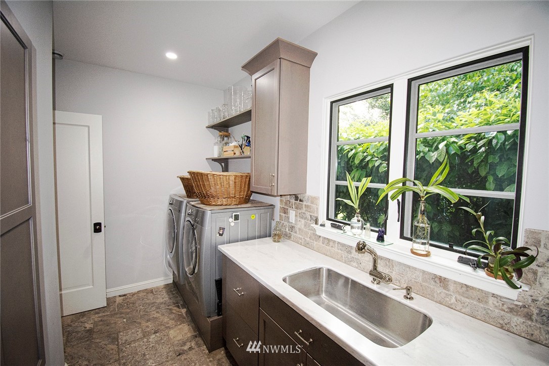 8635 Fauntleroy Way Southwest Seattle, WA 98136 - Photo 8 of 36 a kitchen with a sink and a large window