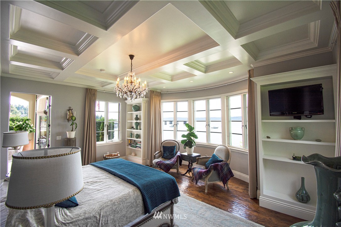 8635 Fauntleroy Way Southwest Seattle, WA 98136 - Photo 10 of 36 a bedroom with furniture and a chandelier