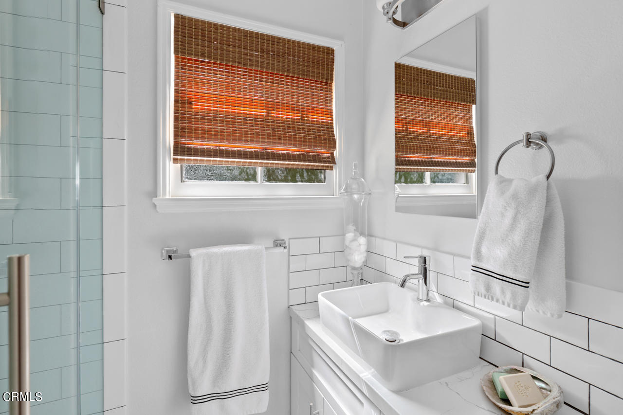2355 Brigden Road Pasadena, CA 91104 - Photo 21 of 30 a bathroom with a granite countertop sink and a mirror