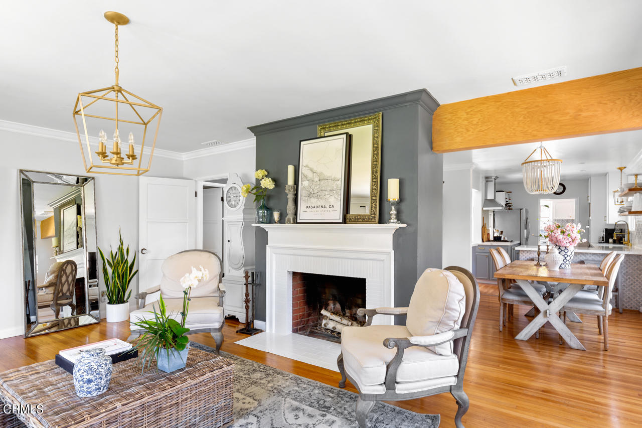 2355 Brigden Road Pasadena, CA 91104 - Photo 5 of 30 a living room with furniture a dining table and a fireplace