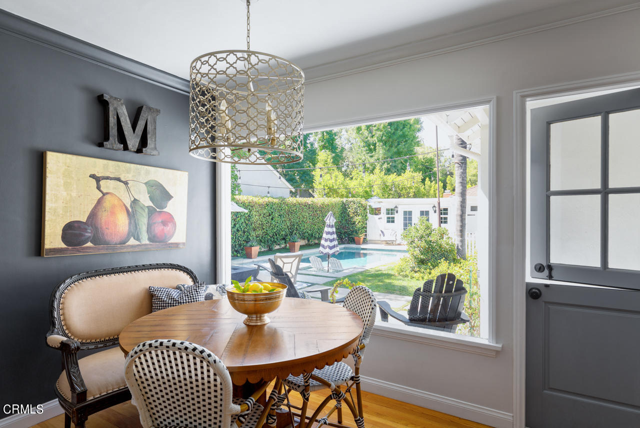2355 Brigden Road Pasadena, CA 91104 - Photo 10 of 30 a view of a dining room with furniture a chandelier and window