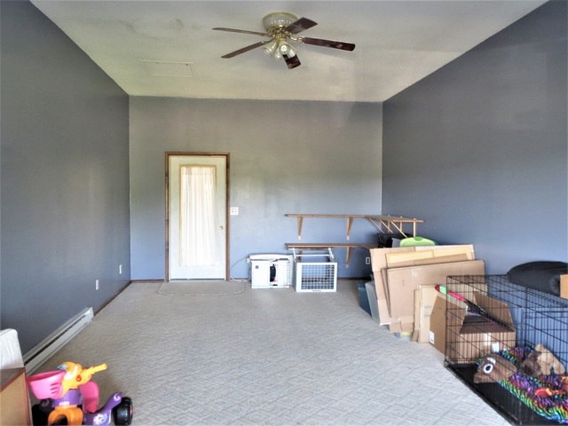 9536 West Woosung Road Dixon, IL 61021 - Photo 17 of 24 a living room with a baby crib furniture and a window