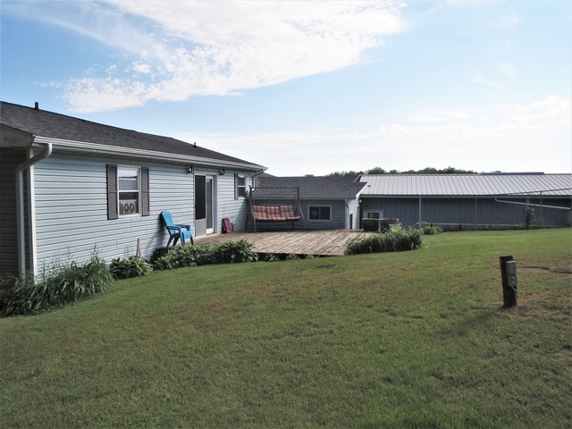 9536 West Woosung Road Dixon, IL 61021 - Photo 20 of 24 a front view of a house with a yard