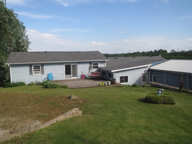 9536 West Woosung Road Dixon, IL 61021 - Photo 21 of 24 a front view of a house with a garden