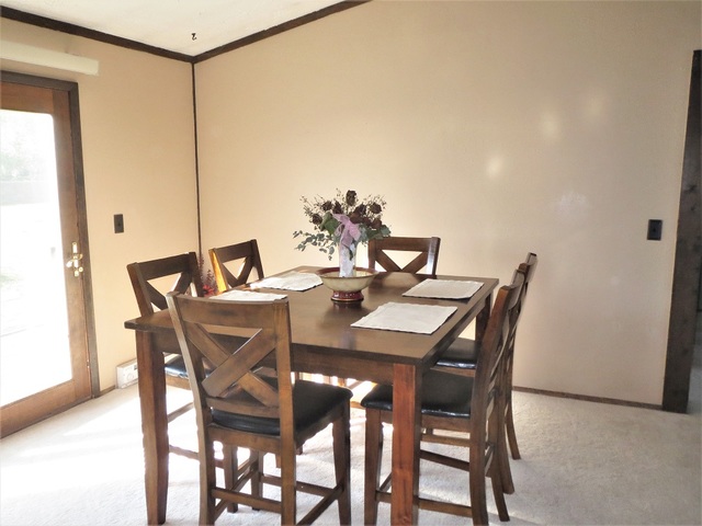 9536 West Woosung Road Dixon, IL 61021 - Photo 6 of 24 a view of a dining room with furniture and window