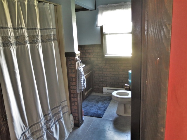 9536 West Woosung Road Dixon, IL 61021 - Photo 7 of 24 a bathroom with a toilet and a shower