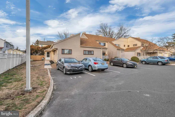 a view of a cars park in front of house