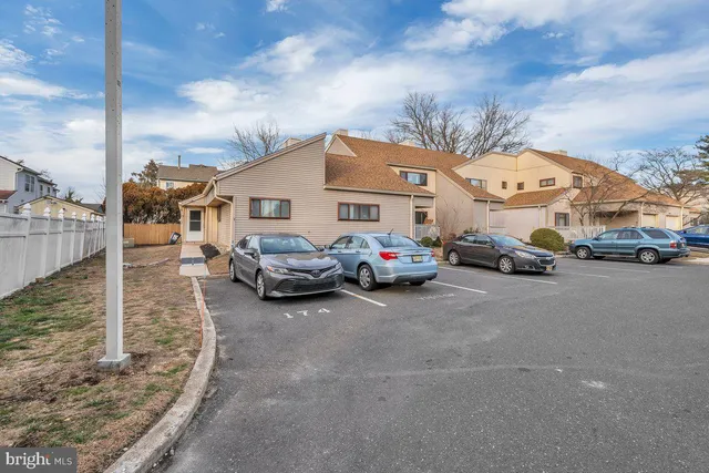 a view of a cars park in front of house