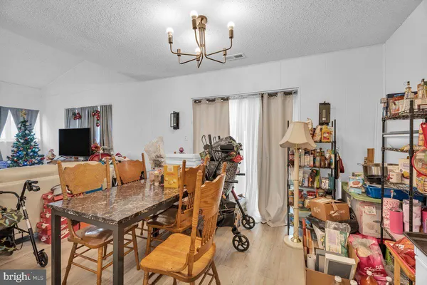 a view of a livingroom with furniture and a flat screen tv