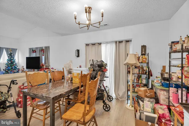 a view of a livingroom with furniture and a flat screen tv