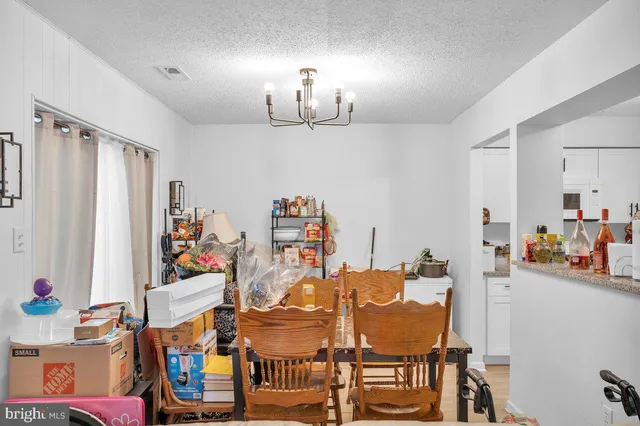 a room with furniture and a chandelier