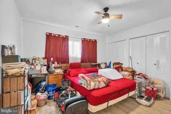 a bedroom with furniture and a chandelier