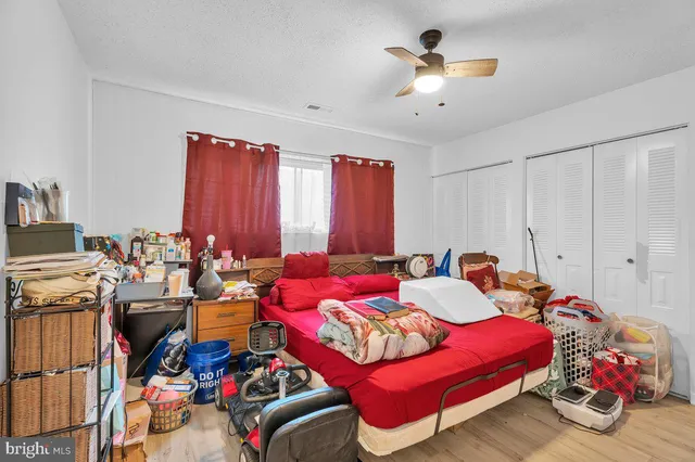 a bedroom with furniture and a chandelier