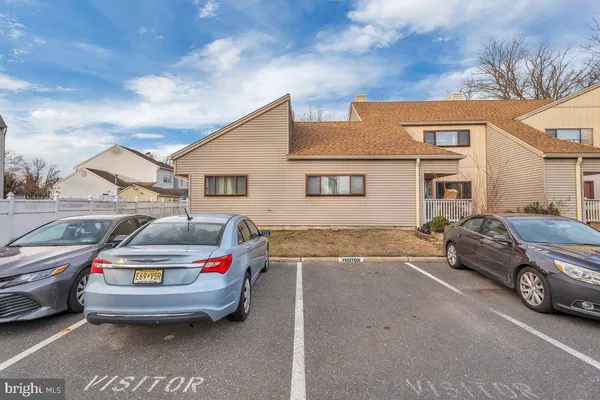 a car parked in front of a house