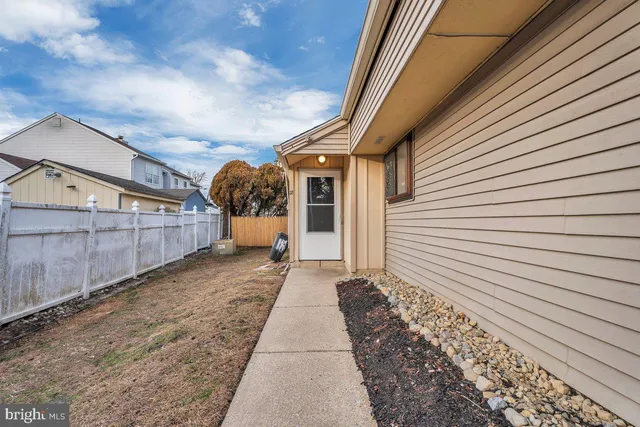 a view of a back yard of the house