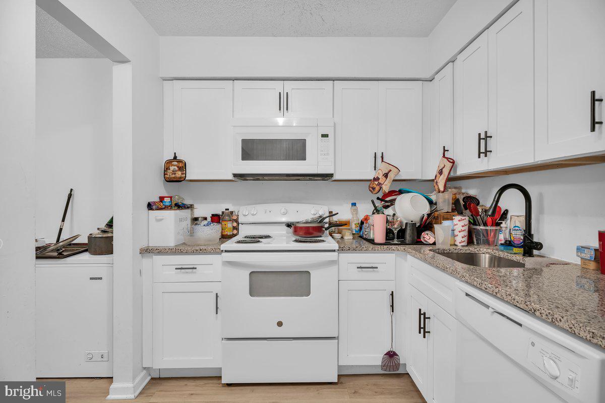 18 Chiswick Drive Lindenwold, NJ 08021 - Photo 10 of 23 a kitchen with white cabinets and sink