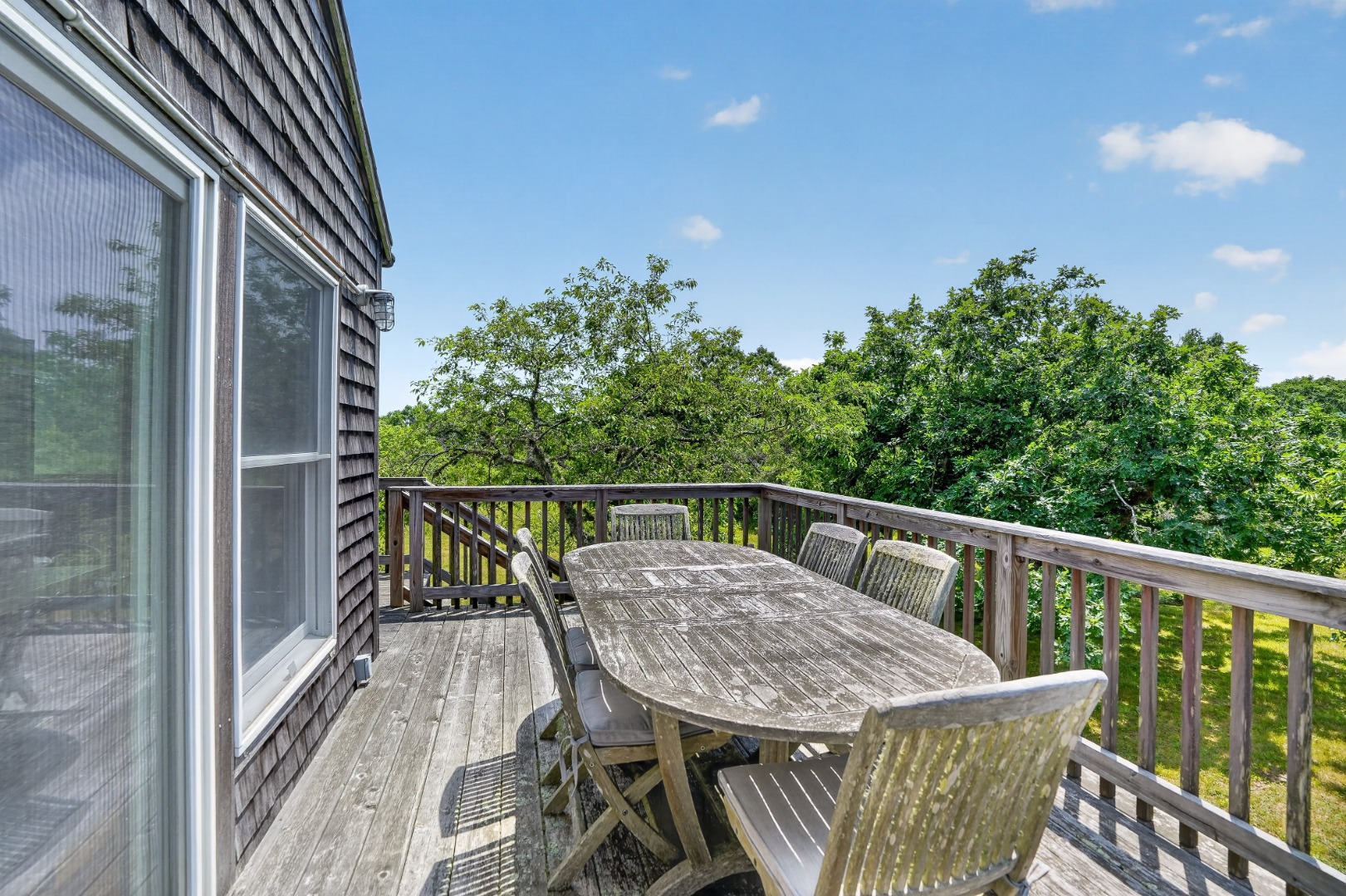 28 Black Point Road Chilmark, MA 02535 - Photo 15 of 56 Elevated deck with stairs down to the yard.