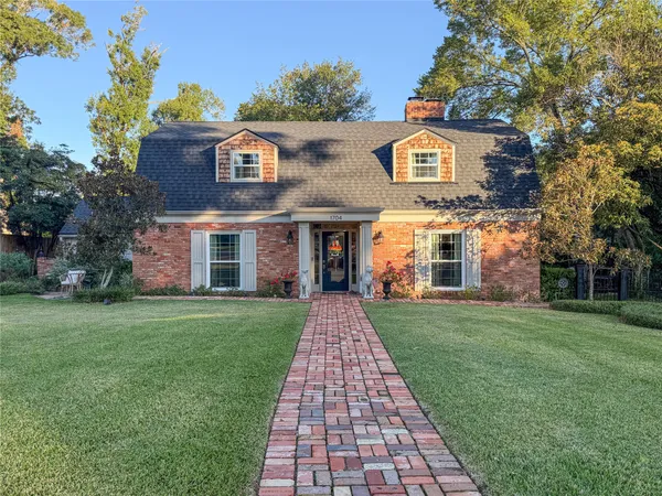 a front view of a house with yard