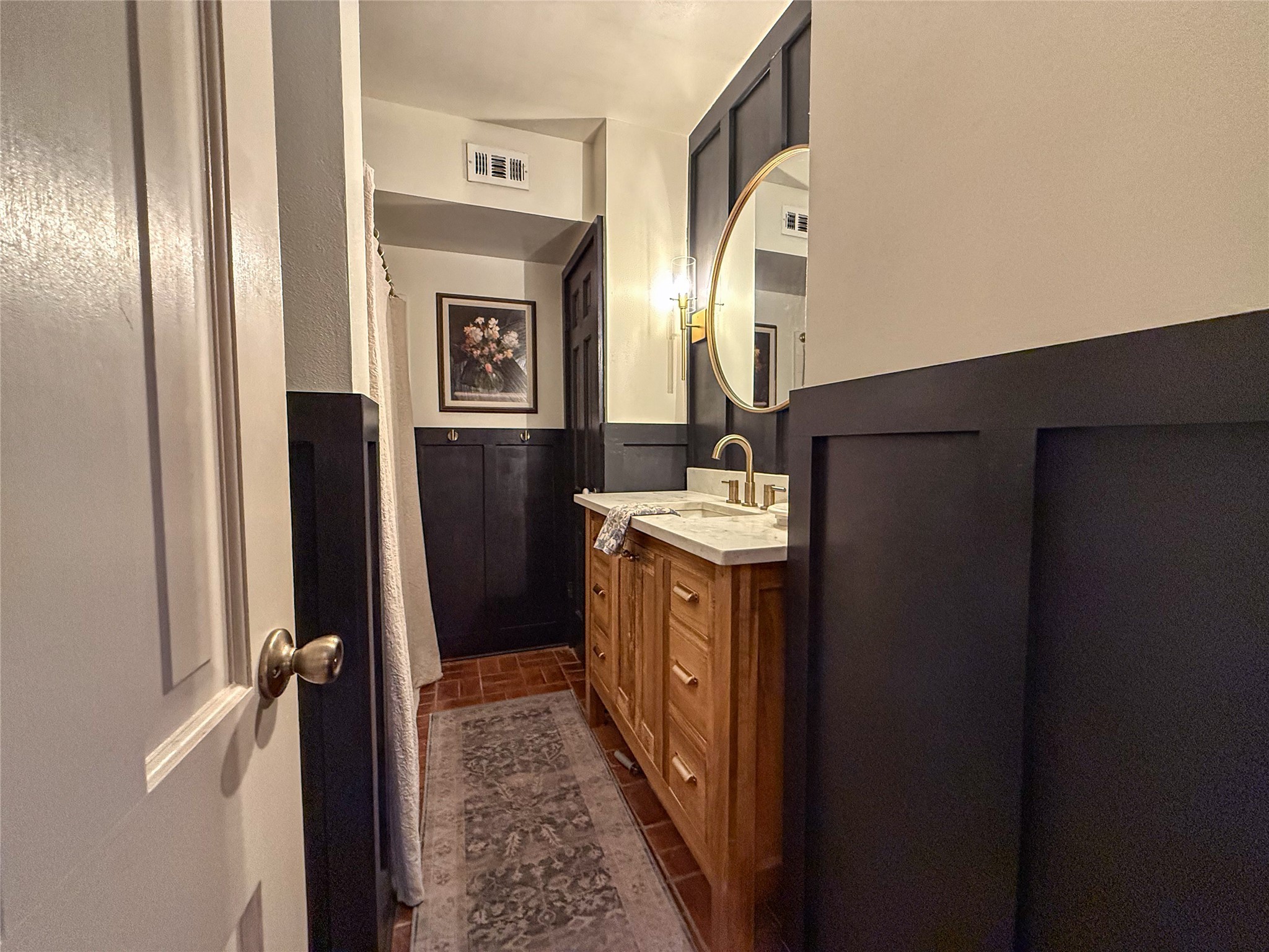 1704 Harrison Road Brenham, TX 77833 - Photo 21 of 34 a bathroom with a sink a mirror and a shower