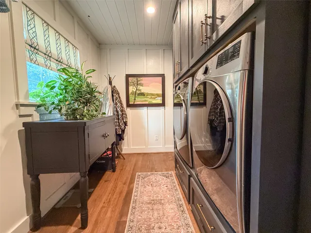 a view of a hallway with washer and dryer