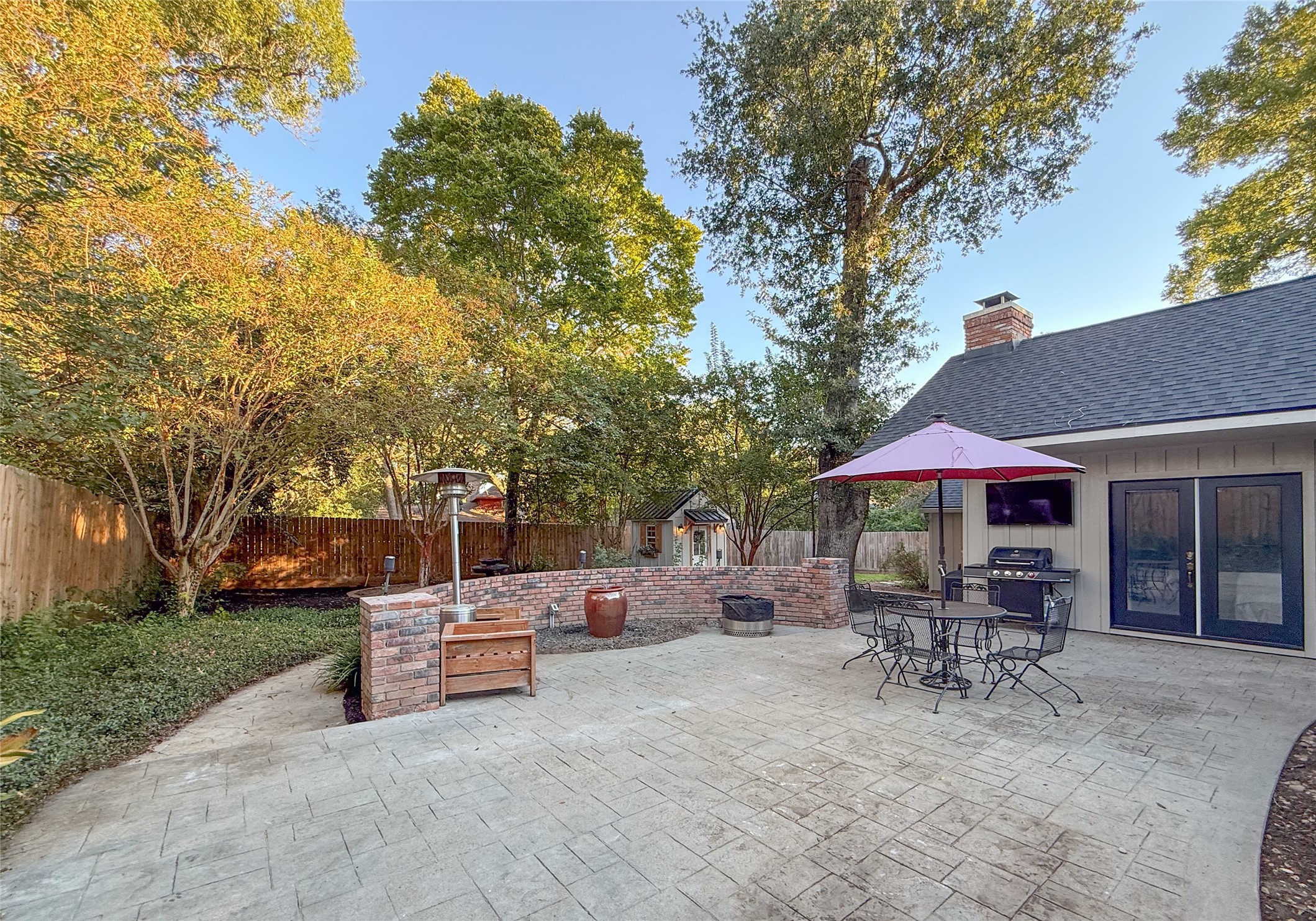 1704 Harrison Road Brenham, TX 77833 - Photo 26 of 34 a view of a patio with table and chairs under an umbrella